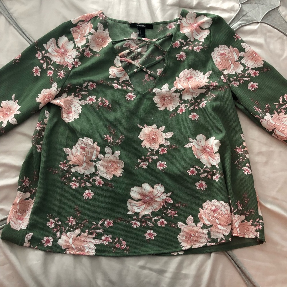 green blouse with pink flowers